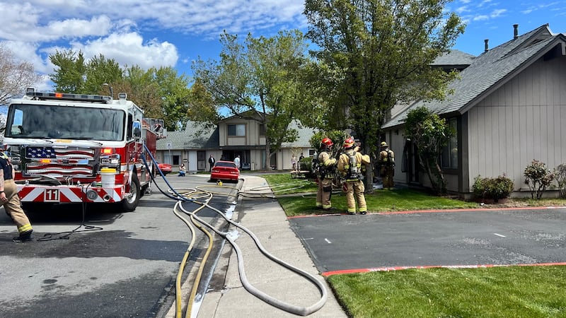 Firefighters respond to a house fire on Oppio Street in Sparks, Nev. on May 6, 2024.