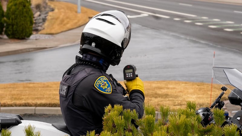 An officer with the Reno Police Department conducts an anti-speeding operation on McCarran
